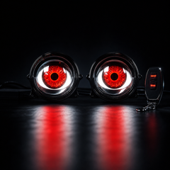 3 inch Devil Eyes LED driving lights mounted on motorcycle crash bars for enhanced visibility and aggressive appearance