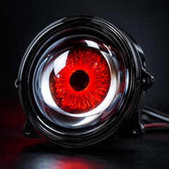 : Bright Devil Eyes LED driving lights illuminating dark roads while displaying vibrant dynamic lighting effects at night