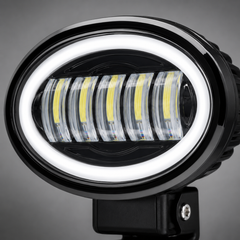Close-up of oval five-eye LED headlight featuring durable housing and high-transmission projector lenses
