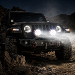 Red LED work light installed on heavy truck rear bumper for enhanced night visibility and safety lighting