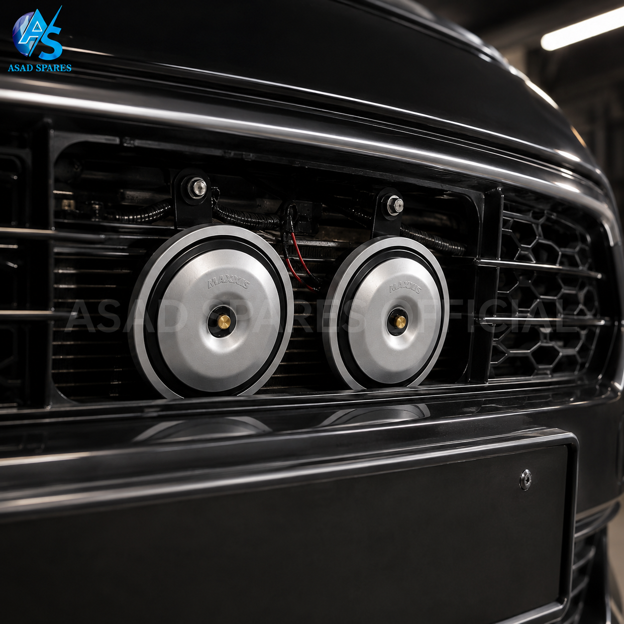 High power disc speaker horn installed behind car grille for upgraded horn performance and stylish appearance