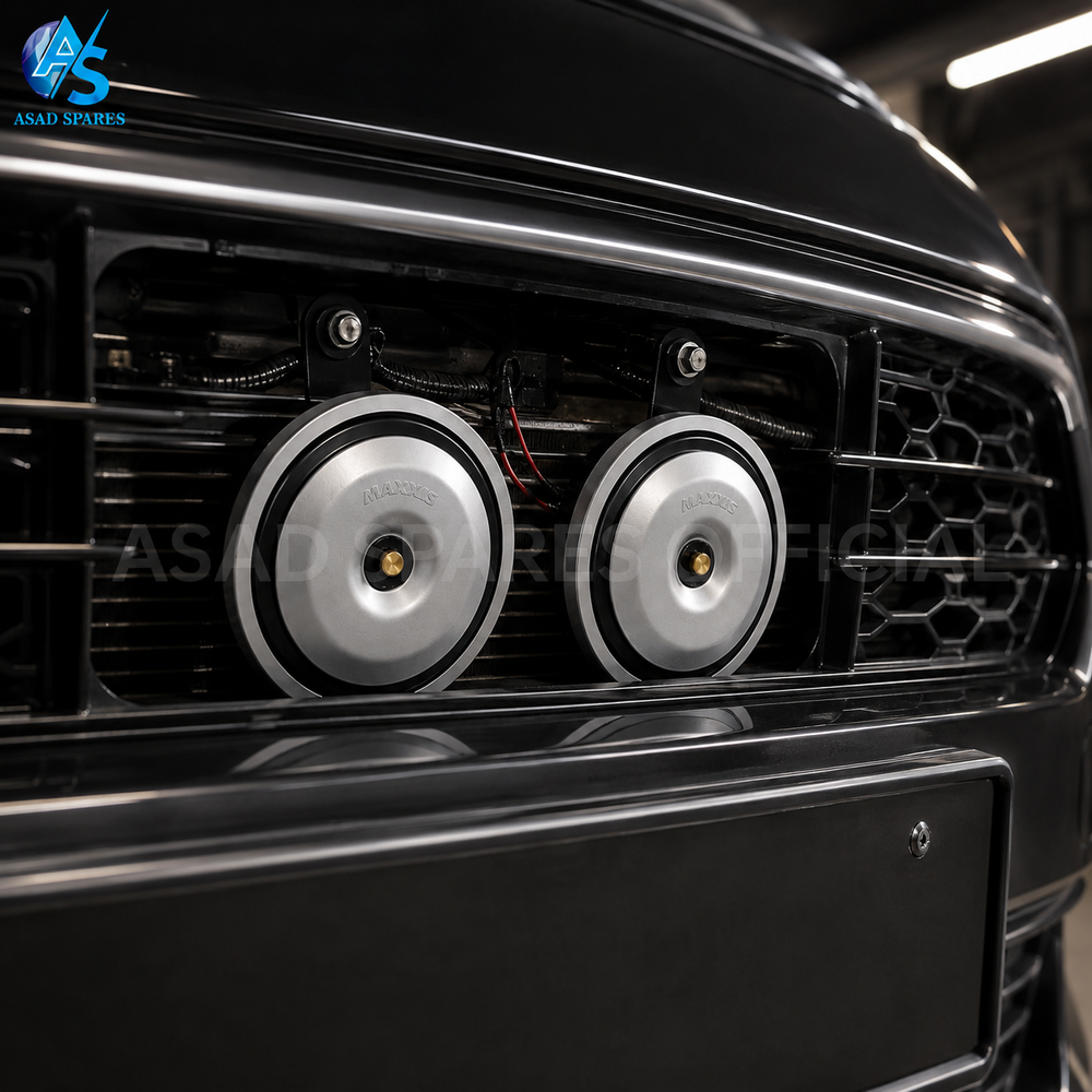 High power disc speaker horn installed behind car grille for upgraded horn performance and stylish appearance